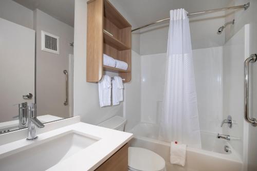 A bathroom at Microtel Inn & Suites by Wyndham Loveland