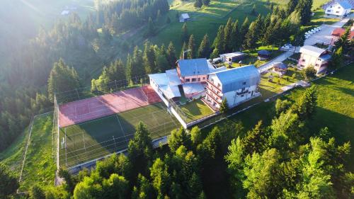 an aerial view of a building in the mountains at Resort EuroPark Fundata in Fundata