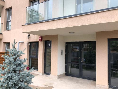 a building with a christmas tree in front of it at Luxury Westpark 2 Residence Lake View W6 in Bucharest