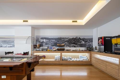 Kuchyň nebo kuchyňský kout v ubytování Stay Hotel Leiria Centro