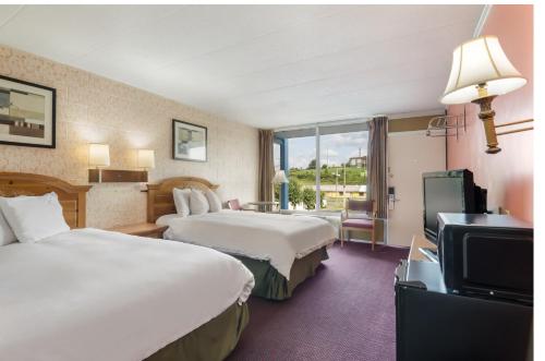 Ένα ή περισσότερα κρεβάτια σε δωμάτιο στο Americas Best Value Inn Wytheville