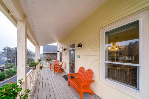 a porch with benches and a window on a house at Mermaids Grotto in Lincoln City