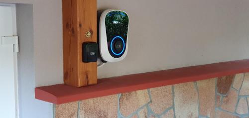 a remote control is attached to a wall at Kéknefelejcs Vendégház in Zalakaros