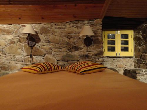 Postel nebo postele na pokoji v ubytování Casa dos Livros