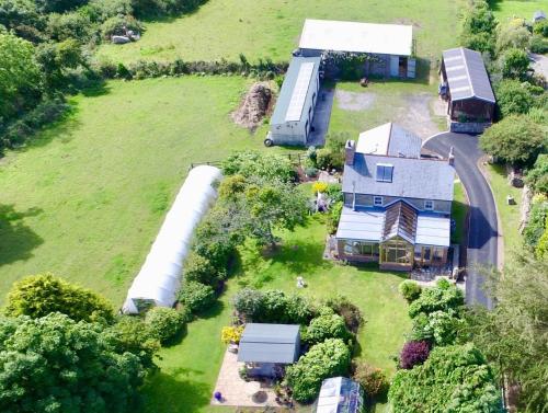 an aerial view of a farm with a house at Lower Crankan Farm in Penzance