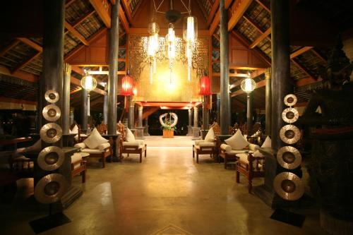 a large room with chairs and a chandelier at Khum Phaya Resort & Spa Boutique Collection in Chiang Mai