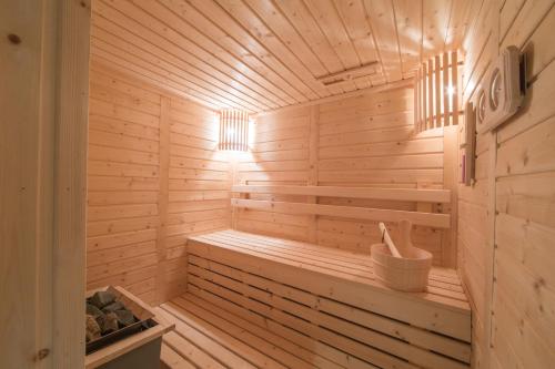a wooden sauna with a bench in a room at Centara Life Maris Resort Jomtien in Jomtien Beach