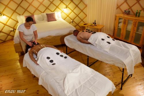 two men in a room with two beds at Helios Luxury Suites in Had Nes