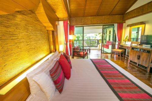 a bedroom with a bed in a room at Centara Koh Chang Tropicana Resort in Ko Chang