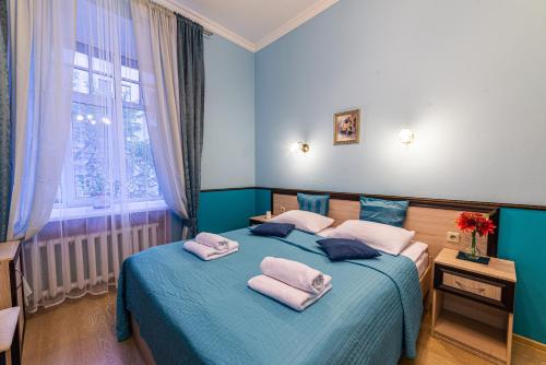 Ліжко або ліжка в номері Rada mini-hotel