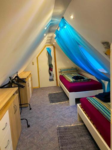 a bedroom with two beds in a tent at Ferienwohnung Dinkelscherben in Dinkelscherben