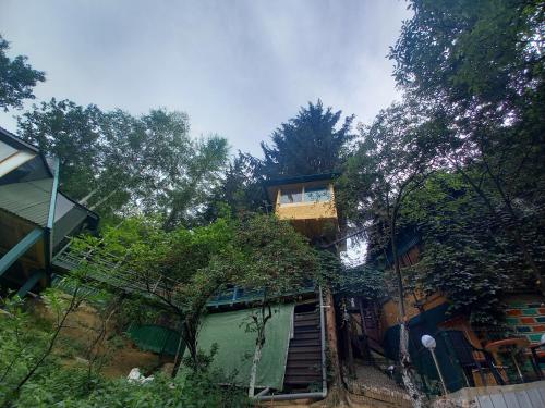 a house with a staircase leading up to it at Holiday Home Nature Neno in Visoko
