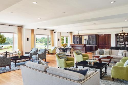 a large living room with couches and chairs at The Tides Inn in West Irvington