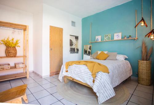 Кровать или кровати в номере “Casa Raíz” habitaciones Boho