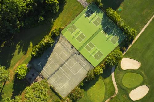 an aerial view of a large field with solar panels at The Tides Inn in West Irvington
