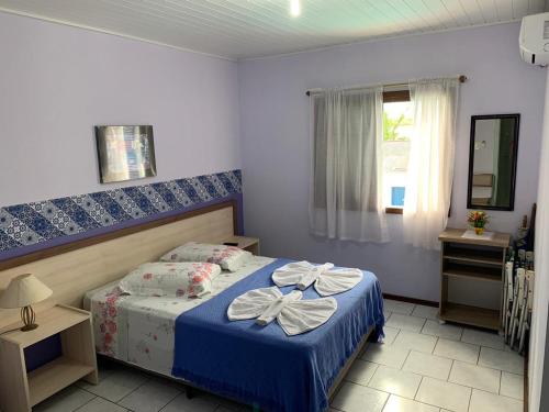 Postel nebo postele na pokoji v ubytování Hotel Sereia