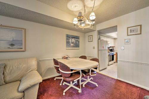 a kitchen and dining room with a table and a couch at Townhome with Balcony Less Than 1 Mi to Wildwood Crest BCH! in Wildwood Crest