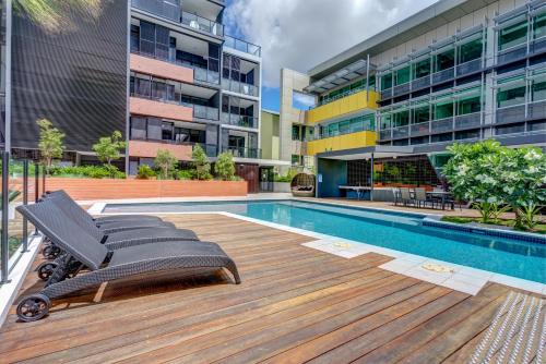 a swimming pool in the middle of a building at Arena Apartments by CLLIX in Brisbane