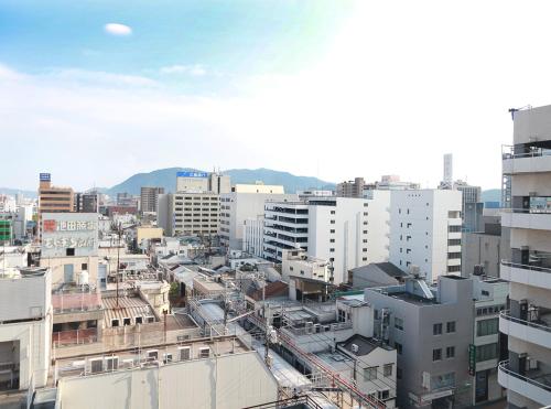 a view of a city with tall buildings at Hotel Trend Fukuyama Ekimae in Fukuyama