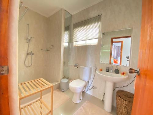 a bathroom with a toilet and a sink and a shower at Dusk To Dawn in Victoria