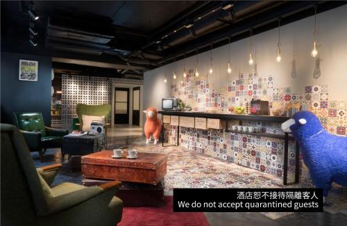 a room with a table and two birds on the wall at attitude on granville in Hong Kong
