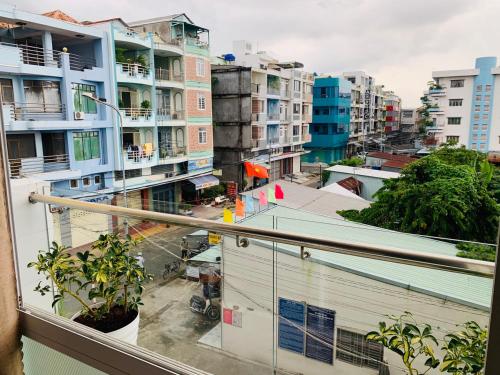 a view of a city from a balcony at Mekong Rose Hotel in Can Tho