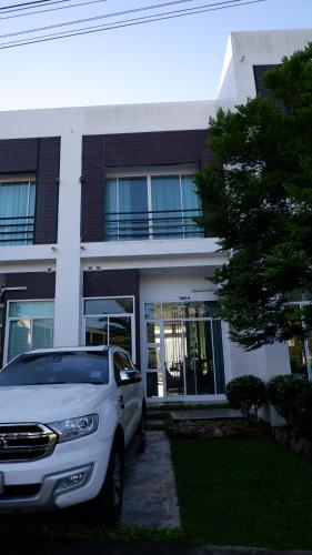 a white car parked in front of a building at The Midst by The M - Nakhon Nayok TMD4 in Ban Som Phung Haeng (1)
