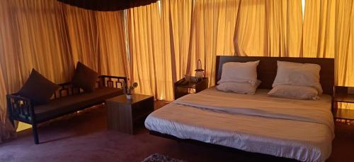 Ένα ή περισσότερα κρεβάτια σε δωμάτιο στο Matha Forest Resort