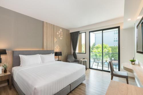 Postel nebo postele na pokoji v ubytování Hotel Amber Pattaya