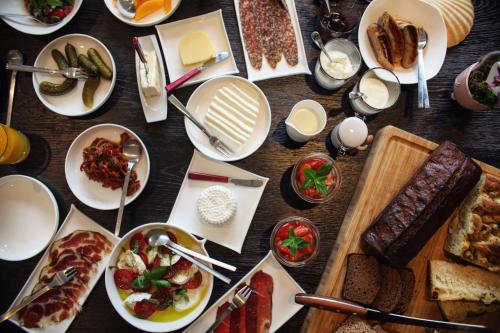 a table full of plates of food on a table at Hensens Residenz in Randerath