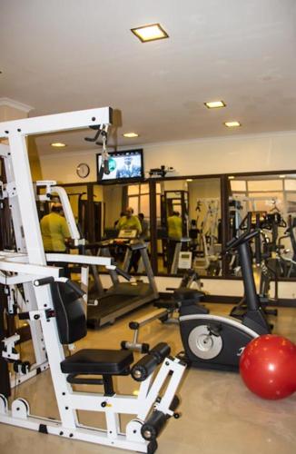 a room with a gym with several tread machines at Hotel Sapphire in Dar es Salaam