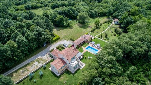 an aerial view of a house with a swimming pool at Villa Lipa in Krnica