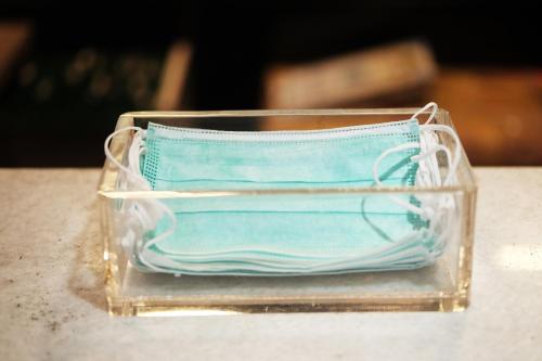 a plastic container with a mask sitting on a table at Dung Khanh Motel in Dĩ An