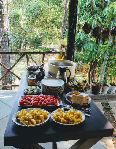 a table with many plates of food on it at Beyond Eco Living in Munnar