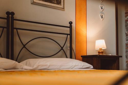 Postel nebo postele na pokoji v ubytování Tenute di Badia