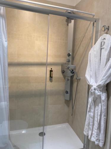 a shower with a glass door in a bathroom at Villa d'Estelle in Cannes