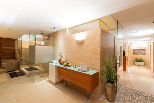 a kitchen with a counter and a glass wall at Altstadthotel Wolf-Dietrich in Salzburg