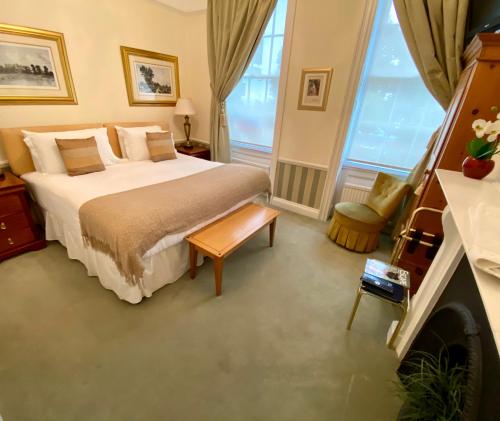 a bedroom with a bed and a large window at Pier View Self Catering Luxury Apartments in Southend-on-Sea