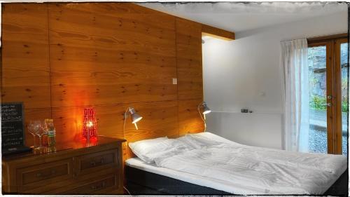 Ένα ή περισσότερα κρεβάτια σε δωμάτιο στο Bergvegen Guesthouse Aalesund