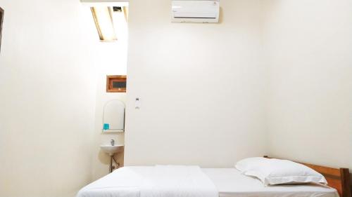 Katil atau katil-katil dalam bilik di Dapur ethnic guesthouse