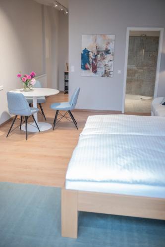 Ένα ή περισσότερα κρεβάτια σε δωμάτιο στο Apartments Leopold Ferdinand