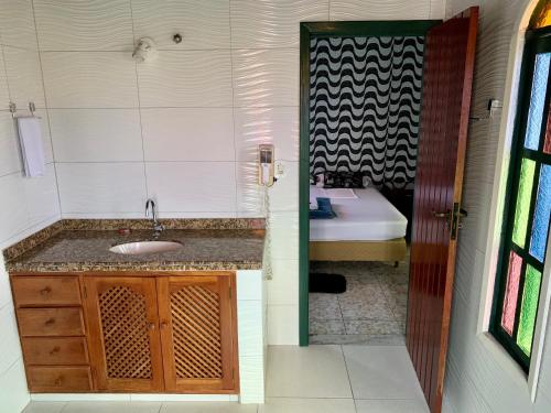 Een badkamer bij Americano's Suítes