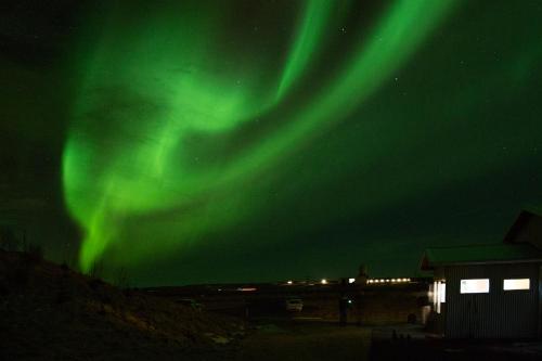 an image of the northern lights in the sky at Lambastadir Guesthouse in Selfoss