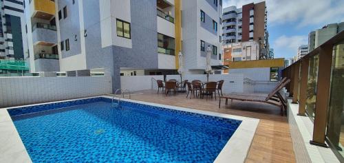 Bazén v ubytování Apartamentos 250m da Orla -Edifício Nugali- Castelo B Temporada nebo v jeho okolí