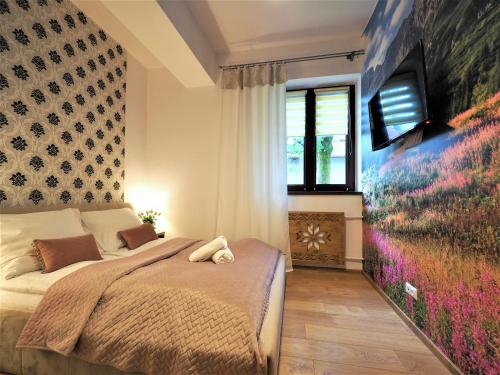 Posteľ alebo postele v izbe v ubytovaní VIP Apartamenty TYTUS