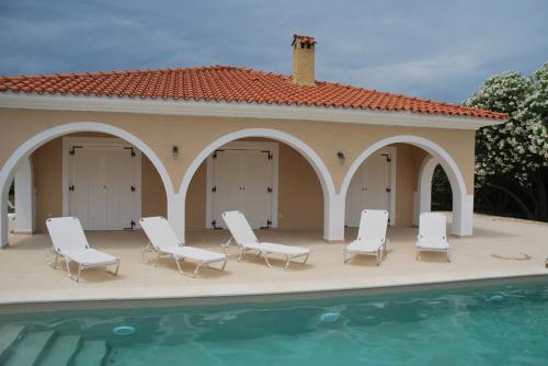 a group of chairs and a swimming pool at Luxury Zante Villa Zante Vista Villa Private Pool Seaviews Agios Sostis in Laganas
