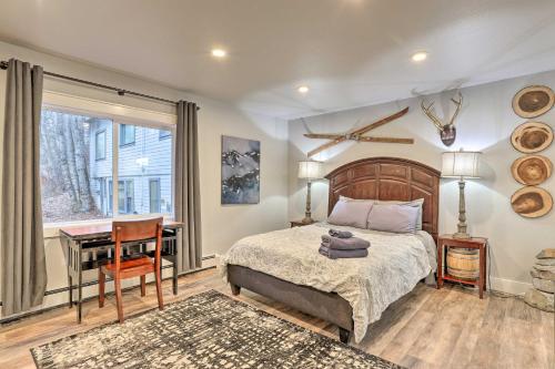 a bedroom with a bed and a desk and a window at Rustic Anchorage Hideaway Walk to Coastal Trail! in Anchorage