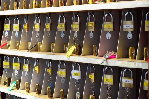 a display of locks on a shelf in a store at Hi! Ostello Milano in Milan
