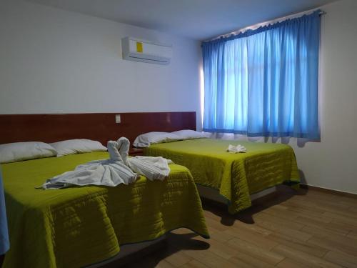 Postel nebo postele na pokoji v ubytování Hotel El Rincon de Don Juan