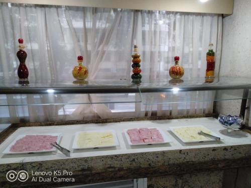 a group of vases sitting on a counter in a room at Hotel Atlântico Avenida in Rio de Janeiro